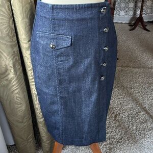 98% cotton, 2% spandex/elastane.  Medium weight denim. Classic pencil skirt.